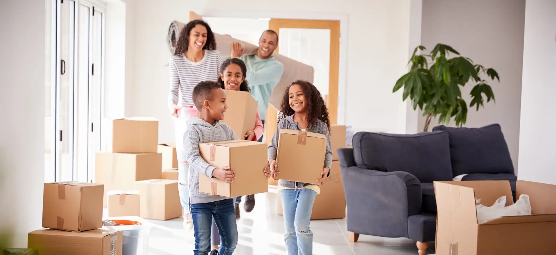 Happy family moving in to their new home thanks to Financial Access Network